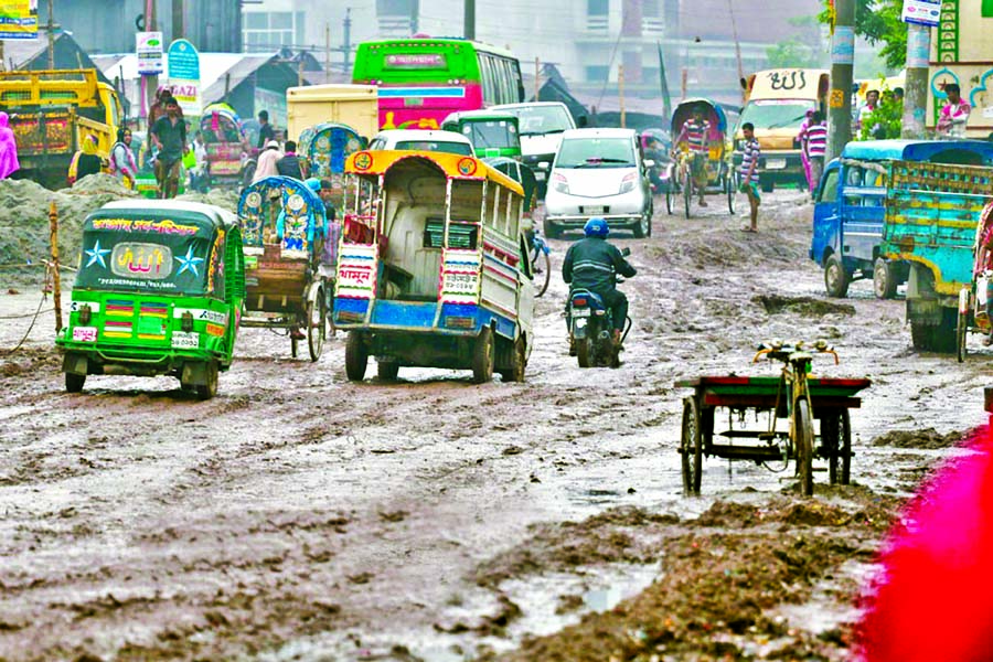 The dilapidated road in Demra at the end of Hanif Flyover is now covered with mud putting the vehicles and commuters at risk of accidents any moment. If there is a little rain, the road goes under water and turns muddy. The photo was taken on Wednesday, s