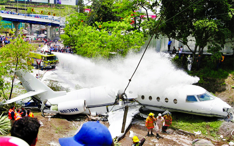 Firefighters doused the wreckage in Honduras with foam.