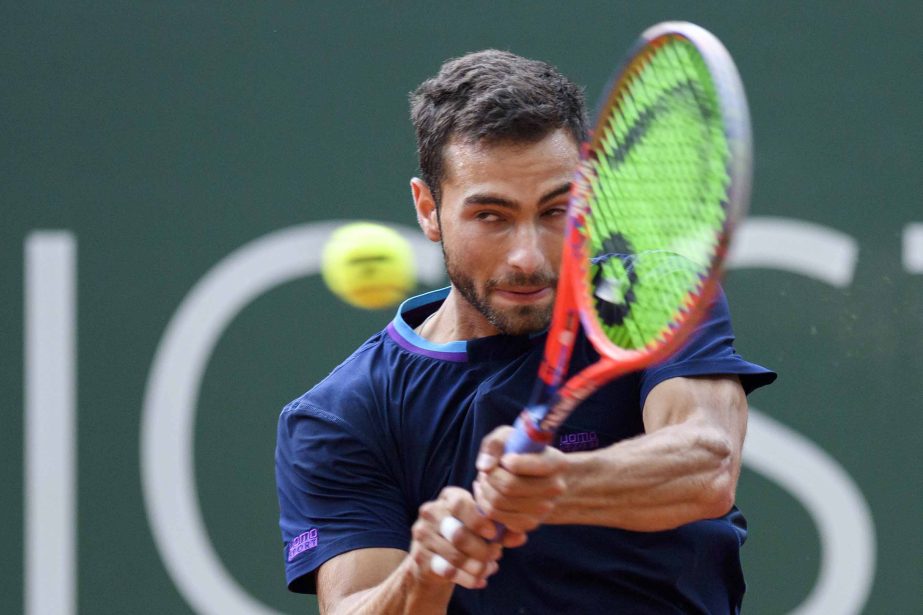 Noah Rubin of the United States returns a ball to Fabio Fognini of Italy during their second round match at the Geneva Open tournament in Geneva, Switzerland on Wednesday.
