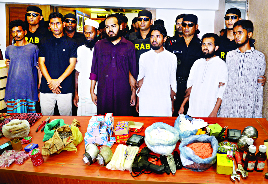 RAB team detained 7 alleged Ansar Al Islam men along with some Jehadi books and bomb making materials from their possessions from different areas of the city. This photo was taken from RAB Media Centre on Thursday.