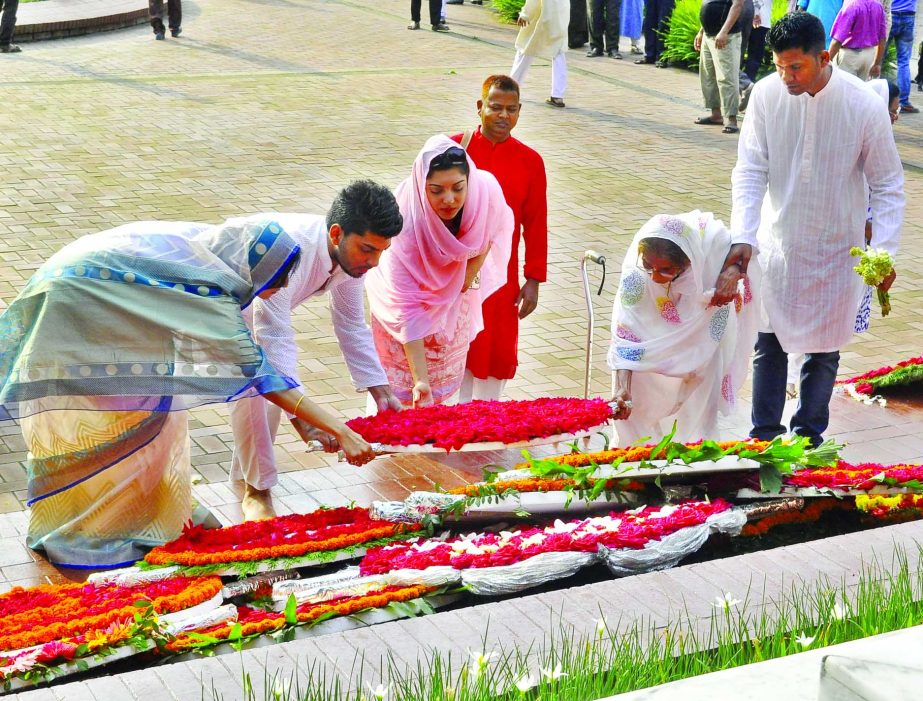 Marking the 119th death anniversary of National Poet Kazi Nazrul Islam, family members of Poet placing floral wreaths at the Mazar on Dhaka University campus on Friday.