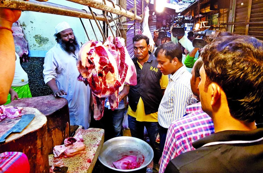 A mobile court led by a magistrate raided Kaptan Bazar meat shops in the city fined Taka four lakhs for selling rotten beef and also at a high price violating govt fixed rate. This photo was taken on Friday.