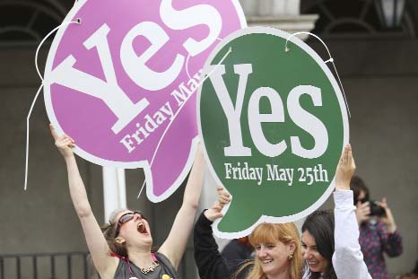 Women celebrate the result of on Saturday's referendum on liberalizing abortion law, in Dublin, Ireland.