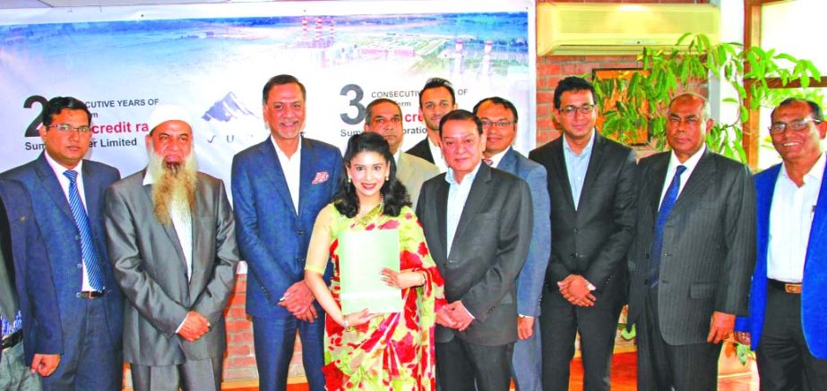 Azeeza Khan, Director of Summit Corporation Limited (SCL) and Summit Power Limited (SPL), poses for a photograph after receiving the AAA credit rating reports from the President and CEO of CRISL Muzaffer Ahmed, FCMA on behalf of the company at a function