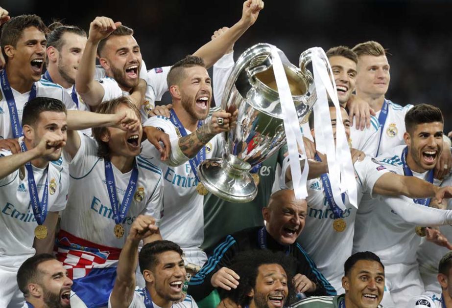 Real Madrid's Sergio Ramos lifts the trophy after winning the Champions League Final soccer match between Real Madrid and Liverpool at the Olimpiyskiy Stadium in Kiev, Ukraine on Saturday.