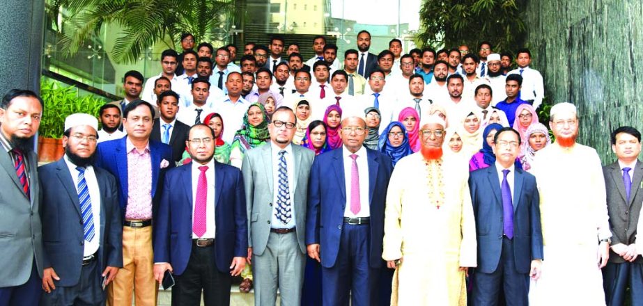 Md. Habibur Rahman Managing Director of Al-Arafah Islami Bank Limited, poses with the participants of 15-day long 'Foundation Course' on banking for newly recruited officers at the banks head office in the city on Sunday. Abdul Malek Mollah, Director, K