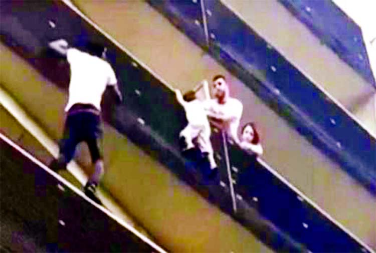 Oblivious to the danger, Mamoudou Gassama rapidly pulled himself from balcony to balcony.