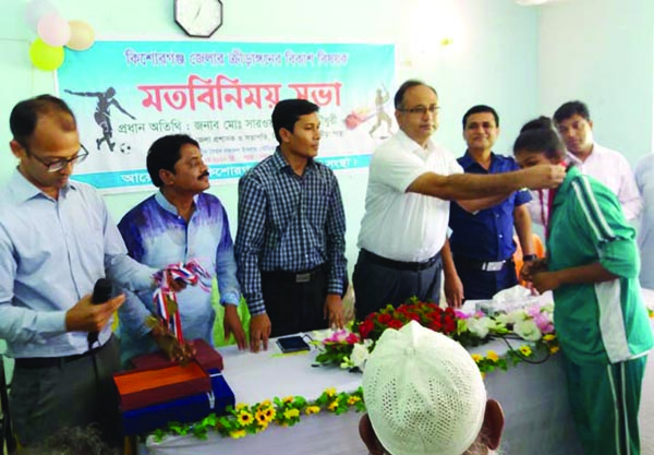 KISHOREGANJ: Reception accorded to the talented sportsmen of kishoreganj at a view exchange meeting organised by Kishoreganj District Sports Association at Syed Nazrul Islam Stadium on Monday. Among others, Md Sarowar Morshed, DC, Kishoreganj, SP Mashr