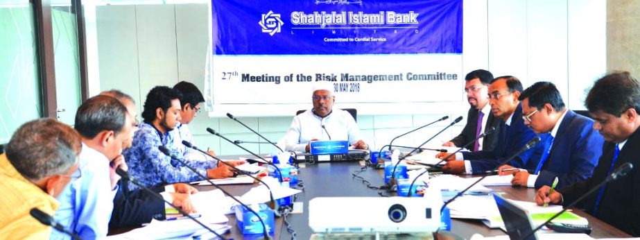 Mohammad Younus, Director and Risk Management Committee Chairman of Shahjalal Islami Bank Limited, presiding over its 27th meeting at its head office in the city on Wednesday. Farman R Chowdhury, Managing Director, Md. Moshiur Rahman Chamak and Khorshed A