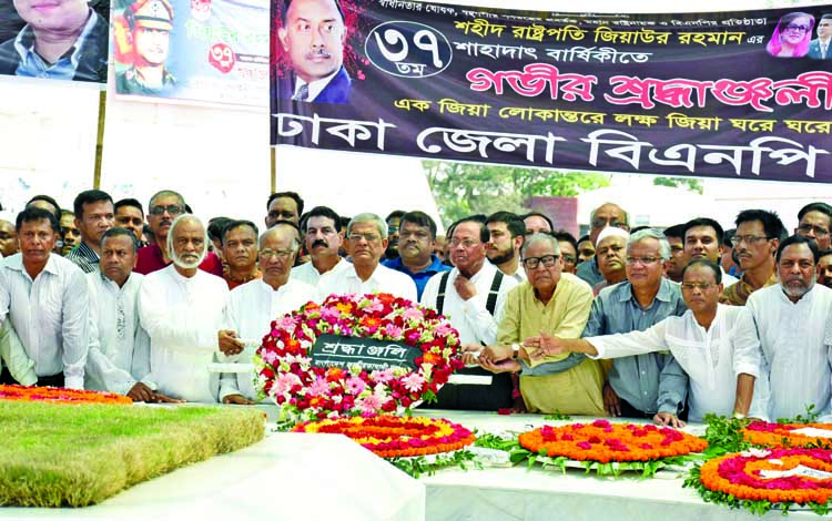 BNP Secretary General Mirza Fakhrul Islam Alamgir along with party leaders and activists placing floral wreaths at the Mazar of Shaheed President Ziaur Rahman in the city on Wednesday marking the latter's 37th martyrdom anniversary.