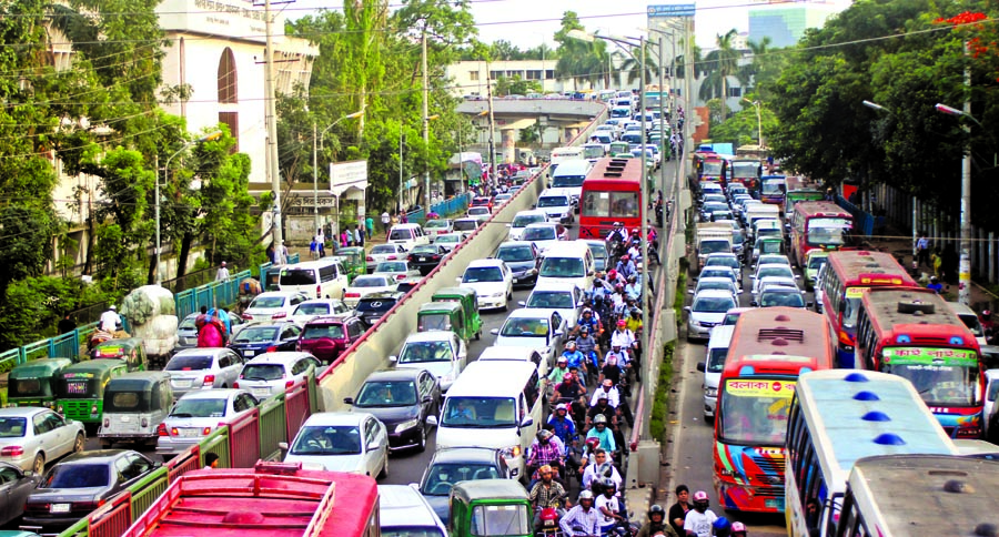 Thousands of vehicles got stuck in a huge gridlock across the capital amid severe heat , causing immense sufferings to commuters. This photo was taken from Tejgaon area on Wednesday.
