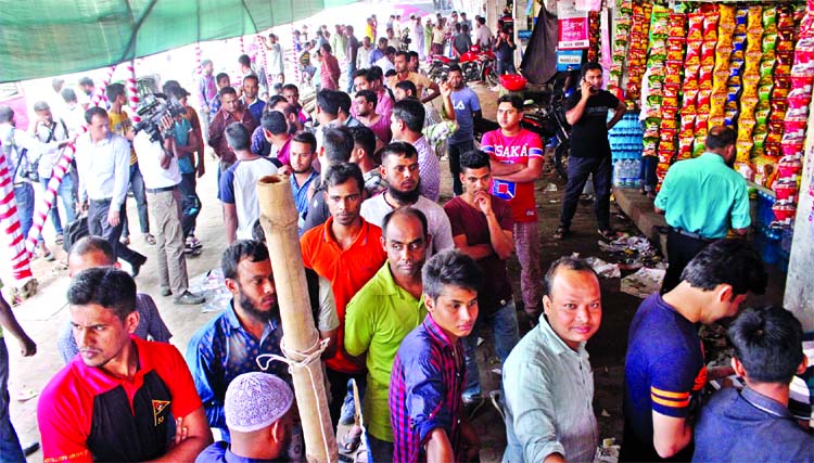 Hundreds of home-goers crowded the bus terminal as advance tickets sales started on Wednesday for inter-district routes. This photo was taken from Gabtali area.