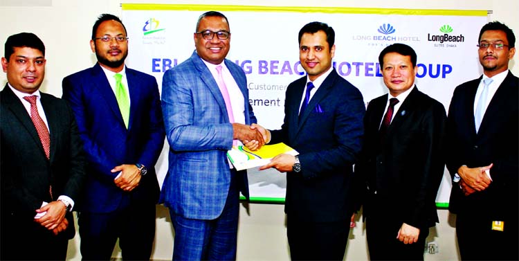 M Khorshed Anowar, Head of Retail Banking of Eastern Bank Limited (EBL) and Md. Walid Shamim, Head of Sales & Marketing of Long Beach Hotel Limited, exchanging agreement signing documents at his head office in the city recently. Under the deal, cardholder