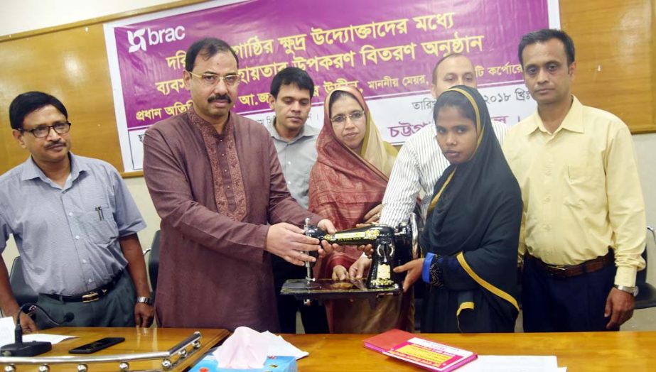 CCC Mayor AJM Nasir Uddin distributing sewing machines among the distressed women at a function on Thursday.