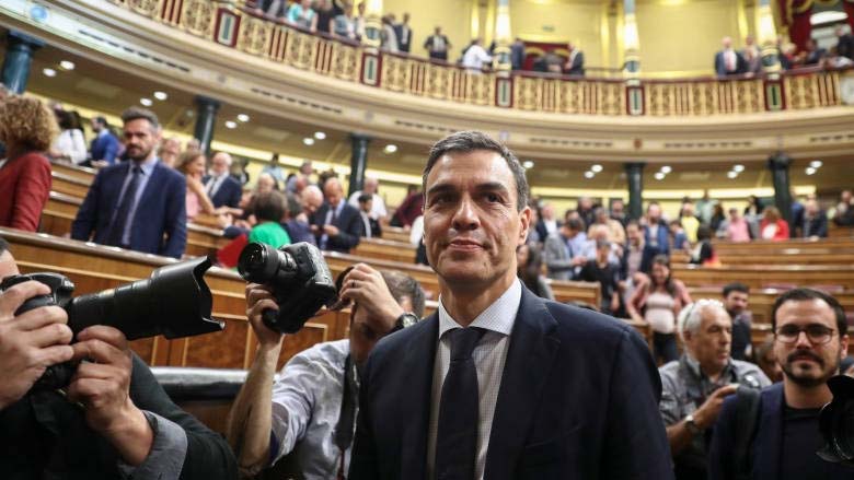 Spain's new Prime Minister-elect Pedro Sanchez stands in the Spanish parliament after Friday's no-confidence vote.