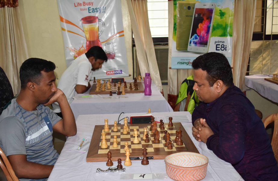 CM Md Sharif Hossain (Left) playing with Md Nasim Hossain Bhuiyan (Right) in the seventh round matches of the Walton International FIDE Rating Chess Tournament at Bangladesh Chess Federation hall-room on Saturday.