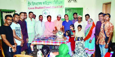 SYLHET: Nibas Chandra Das, Deputy Director, Sylhet District Social Welfare Directorate distributing Eid clothes and iftar items among blind children at D Cap GDF Blind School premises as Chief Guest organised by Green Disabled Foundation (GDF) recently.