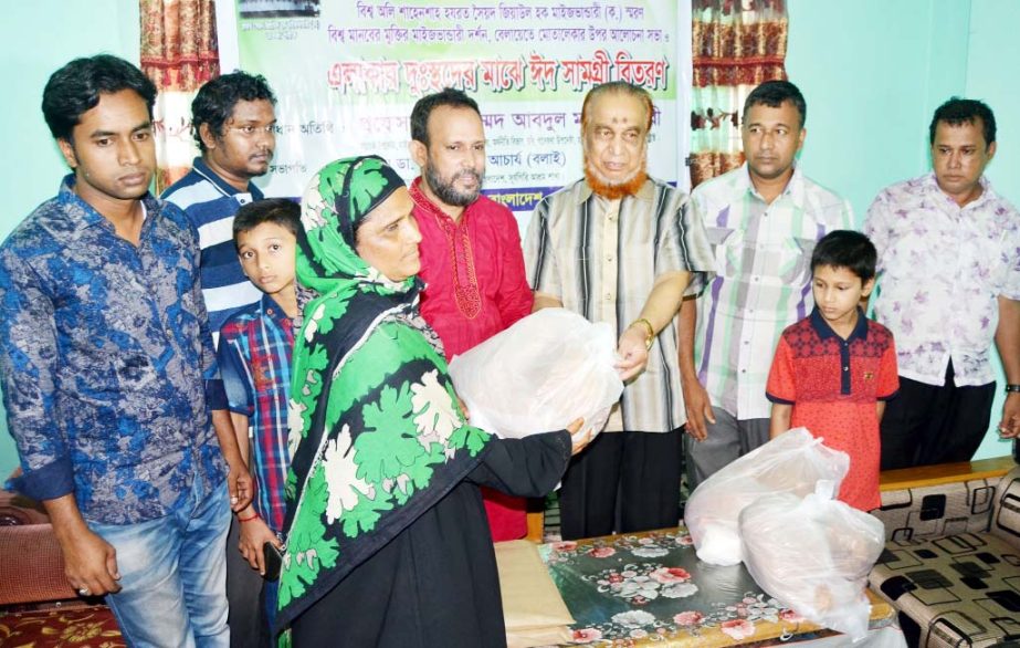 Prof Md Abdul Mannan Chowdhury, Advisor, Maizbhandari Academy Ghousia Huq Committee distributing Eid items among the poor people organised by Maizbhandari Ghousia Huq Committee, Surjogiri Asram Unit recently.
