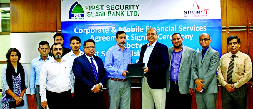 Syed Waseque Md. Ali, Managing Director of First Security Islami Bank Ltd and Mohammad Aminul Hakim, Chief Executive Officer of Amber IT Ltd, exchanging an agreement documents at the bank's head office recently. Under the deal, the clients of the IT Comp