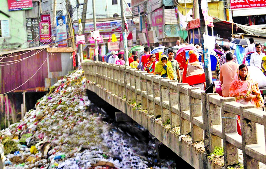 Land grabbers are dumping wastes to occupy the Buriganga River. This picture was taken from Lalbagh Shashanghat area on Sunday.