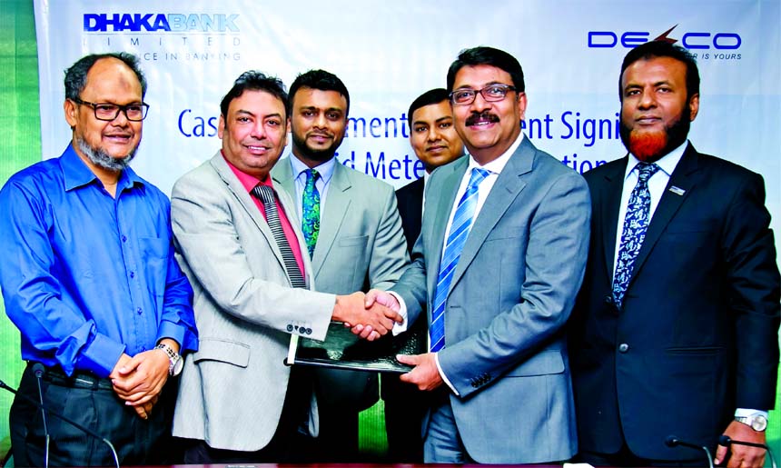 Md. Ziaur Rahman, Head of Corporate Banking Division of Dhaka Bank Limited and SM Zamil Hussain, Company Secretary of Dhaka Electric Supply Company Limited (DESCO) exchanging an agreement signing documents on Cash Management Service at DESCO head office i