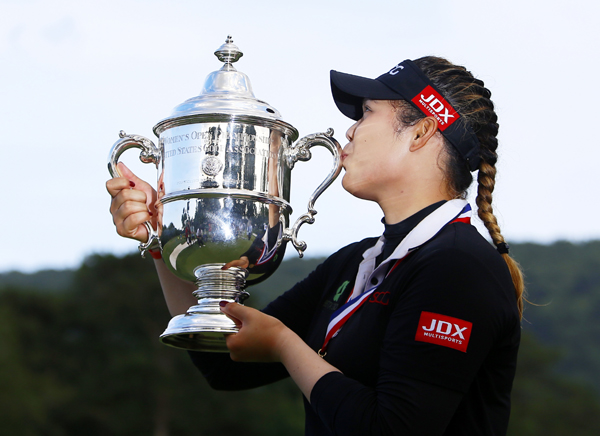 Ariya Jutanugarn, of Thailand, kisses the trophy after winning in a four hole playoff during the final round of the U.S. Women's Open golf tournament at Shoal Creek on Sunday in Birmingham, Ala.