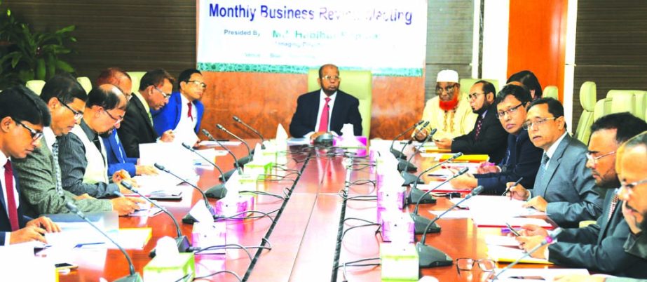 Md. Habibur Rahman, Managing Director of Al-Arafah Islami Bank Limited, presiding over the Monthly Business Review Meeting at its head office in the city on Tuesday. Abdul Malek Molla, Director, Kazi Towhidul Alam, Md. fazlul Karim, SM Jaffar and Mohammed