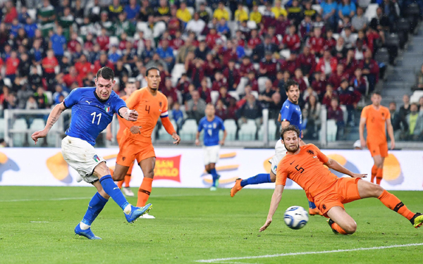 Italy's Andrea Belotti (left) shoots at the goal during the friendly soccer match between Italy and The Netherlands at the Allianz Stadium in Turin, Italy on Monday.