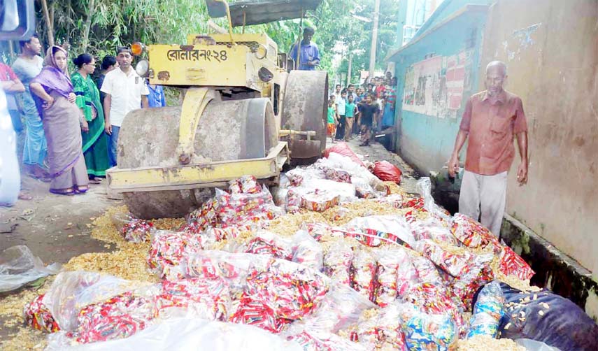 Mobile court destroying unhygienic packet chips at Chhodu Chowdhury Road on Tuesday.