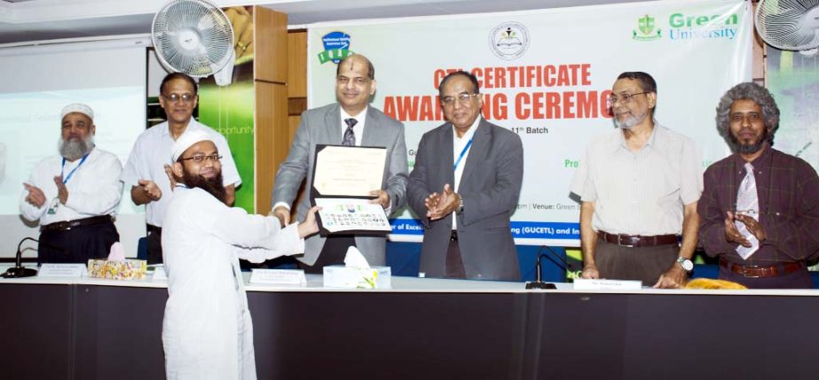 Prof Dr Md. Golam Samdani Fakir, Vice Chancellor of Green University, Bangladesh (GUB) and Prof Dr Yousuf Mahbubul Islam, Vice Chancellor of Daffodil International University distributing certificates among the participants of a Certificate Course in Teac