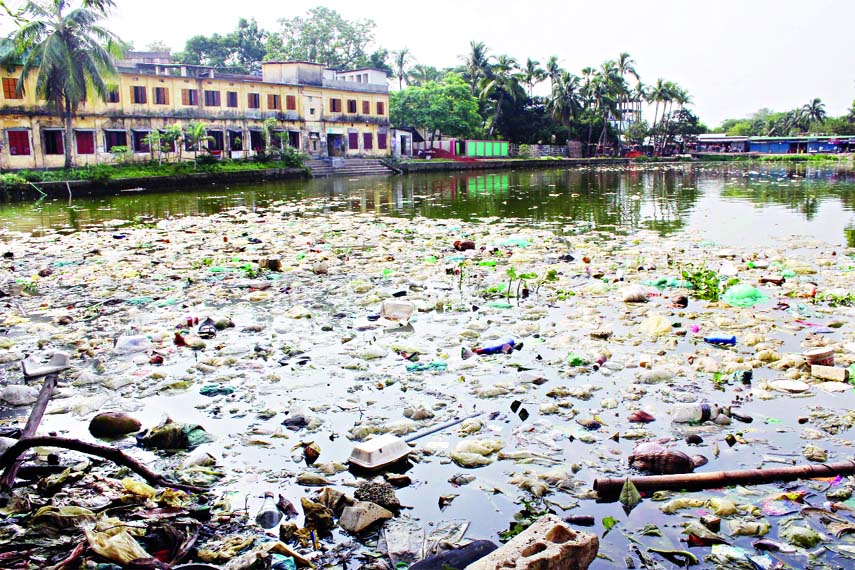 MURADNAGAR (Cumilla): A two hundred years old pond of Jamiya Islamia Mujafarul Uloom Madrasa at Muradnagar Sadar Upazila has turned into a dustbin. This snap was taken yesterday.