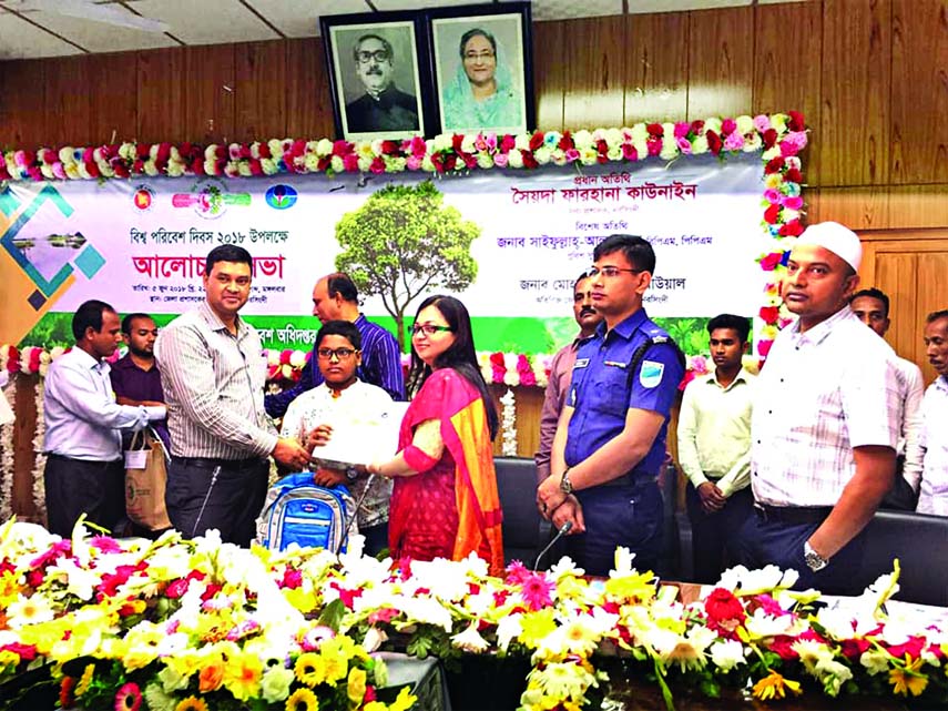 NARSINGDI: Seyda Farhana Kawnine, DC, Narsingdi distributing prizes among the winners of art competition on the occasion of the World Environment Day organised by District Administration and Department of Environment at Shilpakala Academy as Chief Gu