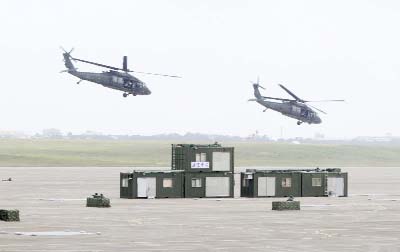 UH-60 Black Hawk helicopters participate in the annual Han Kuang exercises at an air base in Taichung County, Taiwan on Thursday.