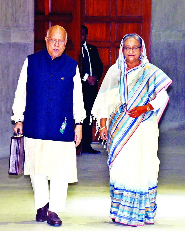 Finance Minister Abul Maal Abdul Muhith along with Prime Minister Sheikh Hasina entering the Parliament Bhaban on Thursday to place the National Budget for 2018-19 fiscal year.