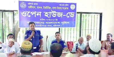 BARISHAL: Banaripara Officer-In-Charge Md Khalilur Rahman speaking at an open house day on drug, child-marriage and militancy on Thursday.