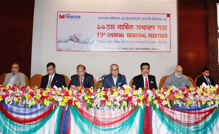 Manwar Hossain, Chairman of BD Finance Limited, presiding over its 19th AGM at a city auditorium on Thursday. Humayun Shoab, Managing Director, Giasuddin Ahmed, Khondker Fazle Rashid, Yousuf Aman, Haider Ahmed Khan, FCA, Ansar Uddin Ahmed, Imtiyaj Yousuf