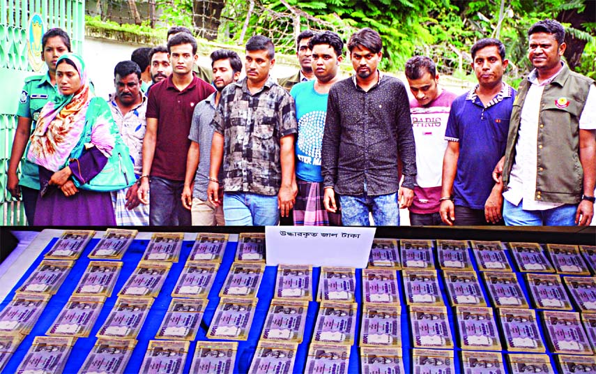 At least ten members of gang of currency counterfeiters were arrested by DB police from city's Kadamtali area and recovered huge fake currency notes on Friday. This photo was taken from DMP media centre.