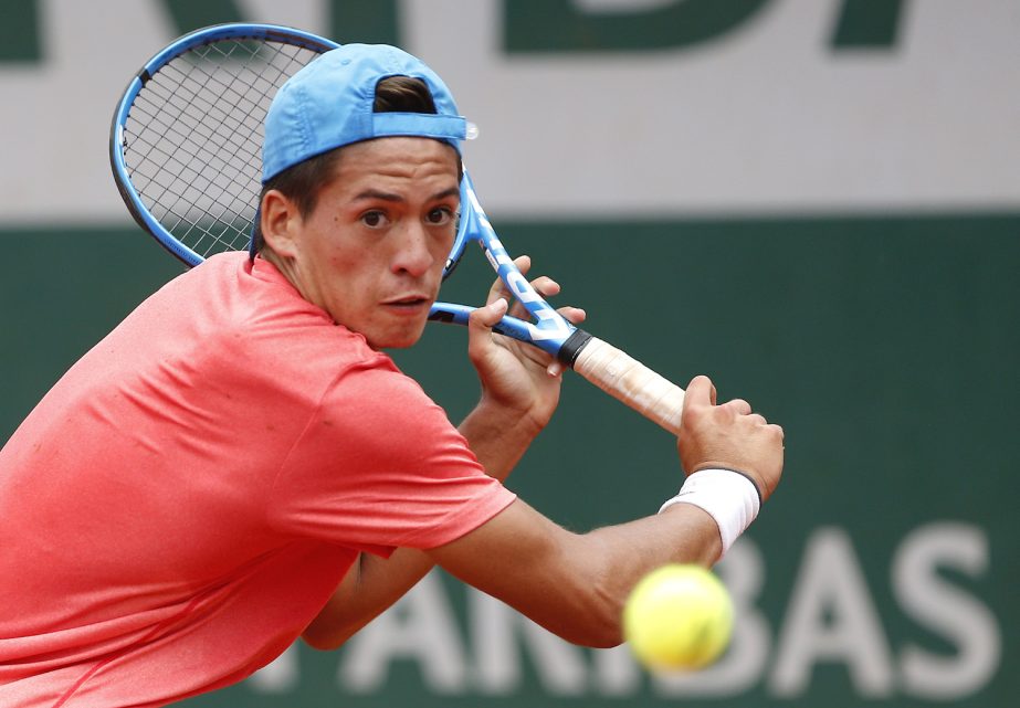 Argentina's Sebastian Baez returns the ball to Taiwan's Tseng Chun Hsin during their boy's singles final match of the French Open tennis tournament at the Roland Garros stadium on Saturday in Paris.
