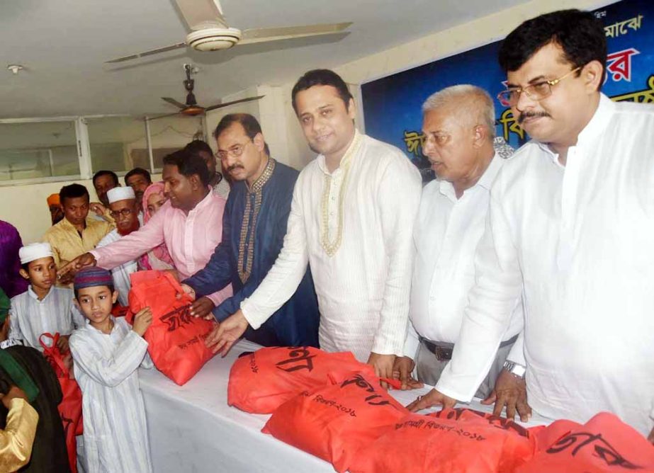CCC Mayor A J M Nasir Uddin distributing Eid items among the orphan children organised by Tarunyo, a social organisation at the Port City on Saturday.