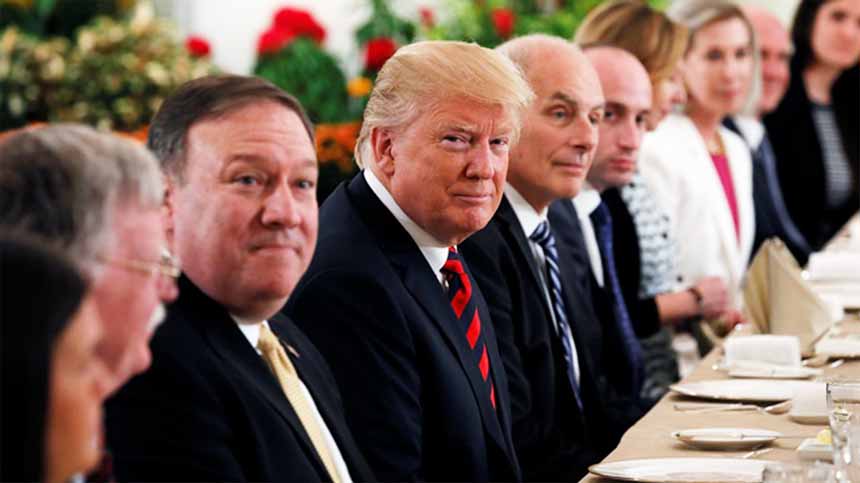 US President Donald Trump flanked by Secretary of State Mike Pompeo and White House Chief of Staff John Kelly attend a lunch with Singapore's Prime Minister Lee Hsien Loong and officials at the Istana in Singapore on Monday.