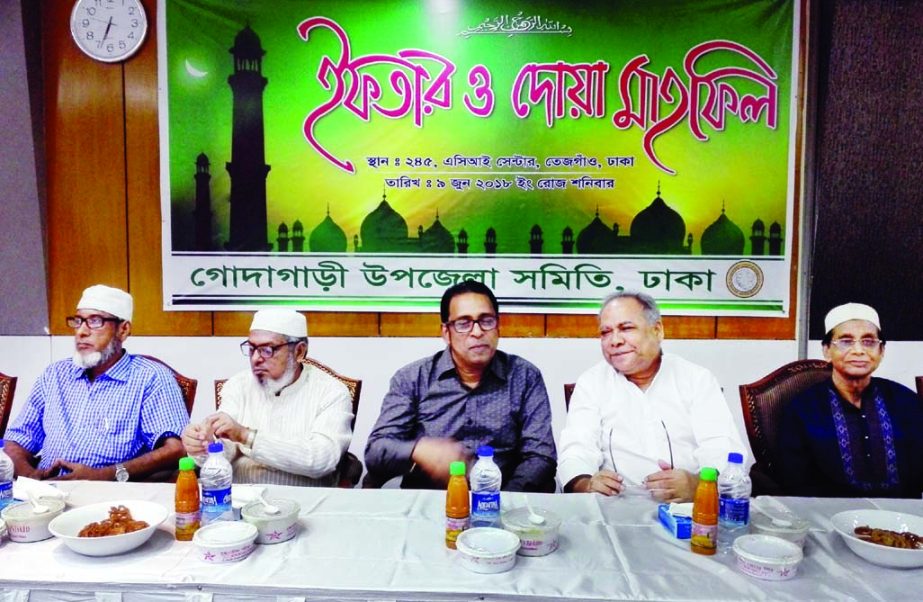 Election Commissioner Rafiqul Islam and Managing Director of ACI Dr. FH Ansarey, among others, at an Iftar and Doa Mahfil organised recently by Godagari Upazila Samity, Dhaka at the head office of ACI Center in the city.