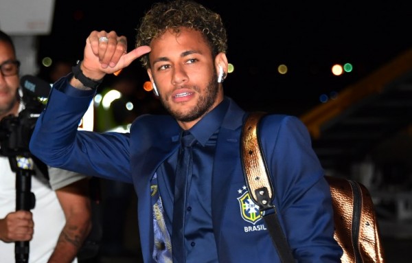 Brazil's forward Neymar gestures upon the team's landing at Sochi Airport in Russia on Monday, ahead of the FIFA World Cup.