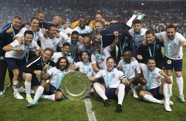 Team England celebrate after winning the UNICEF Soccer Aid match between Team England and Team World XI, at Old Trafford, in Manchester, England on Sunday.