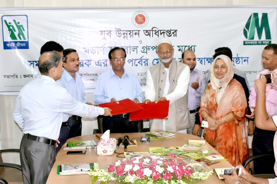 Doctor Alamgir Moti, Chairman of Modern Herbal Group and Md Anowar Hossain, DG of Department of Youth Development, exchanging a signing document at the latterâ€™s office on Monday.