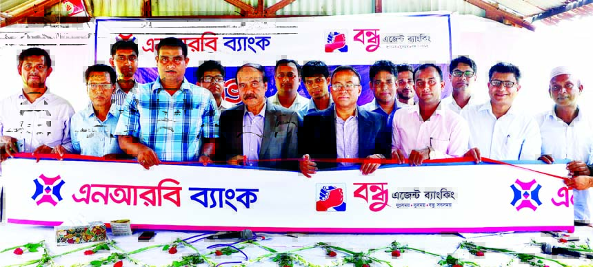 Saaduddin Ahmed, DMD of NRB Bank Limited, inaugurating its Agent Banking Outlet at Boroibari Bazar in Kaliakoir in Gazipur recently as chief guest. AKM Kamal Uddin, Head of Corporate Banking and Milton Roy, Head of Agent Banking of the bank were also pres