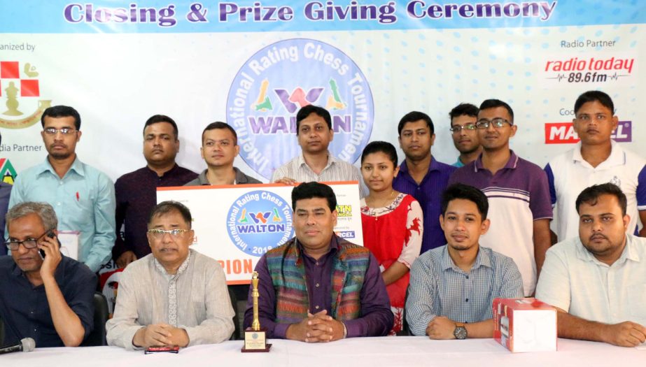 The winners of the Walton International Rating Chess Tournament with the guests and officials of Bangladesh Chess Federation pose for photograph at Bangladesh Chess Federation hall-room on Tuesday.