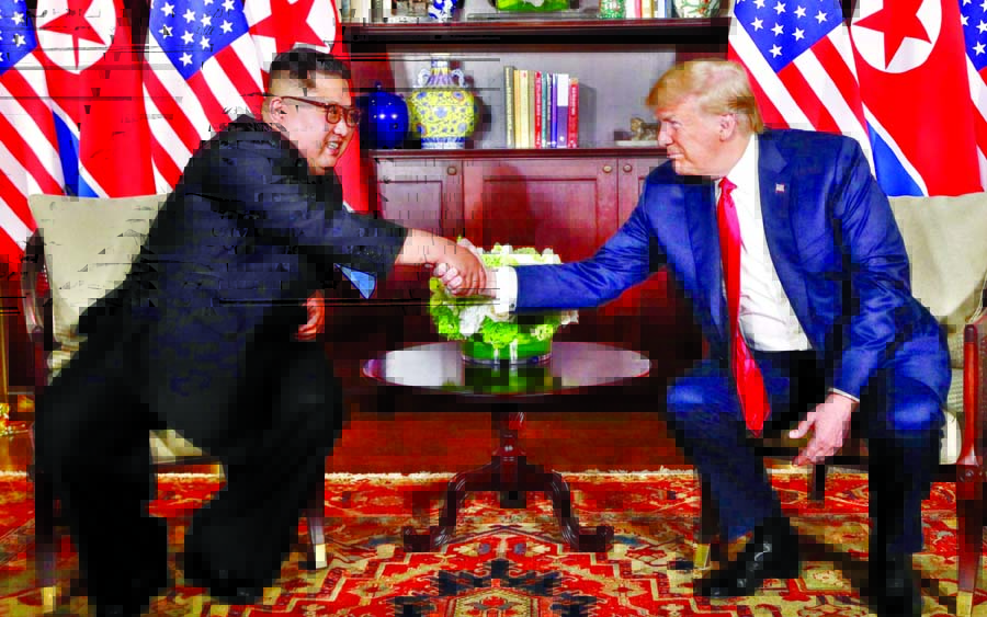 President Donald Trump shakes hands with North Korea leader Kim Jong-un during their first meetings at the Capella resort on Sentosa Island. Internet photo