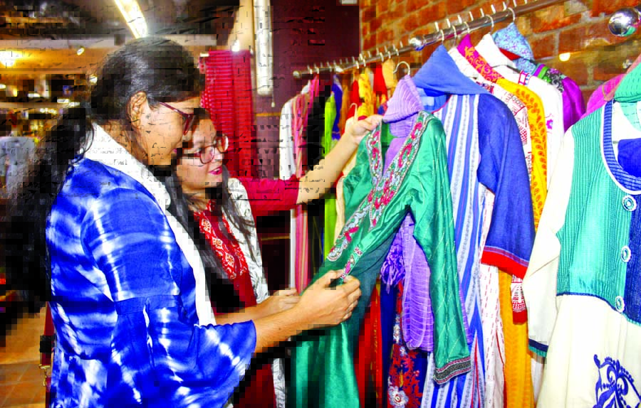 Female customers are making their choice at a shopping mall at Bashundhara City Market on Tuesday.