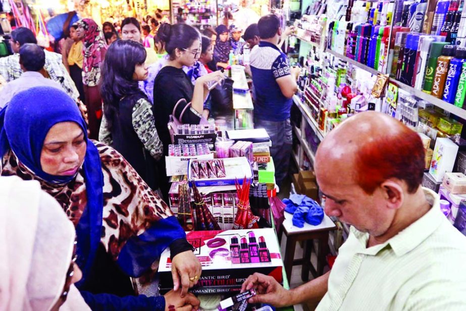 Buyers mostly female crowd the cosmetic shop ahead of the holy Eid- ul-Fitr. The snap was taken from the city's Gausia Market on Wednesday.