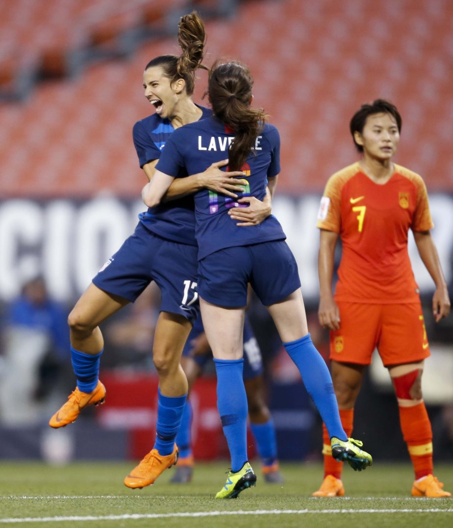 United States' Tobin Heath (left) celebrates with Rose Lavelle after scoring a goal as China's Wang Shuang (7) stands nearby during the second half during an international friendly soccer match on Tuesday in Cleveland. The United States defeated China 2